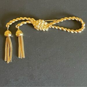 Vintage TRIFARI gold tone rope Tassel brooch.